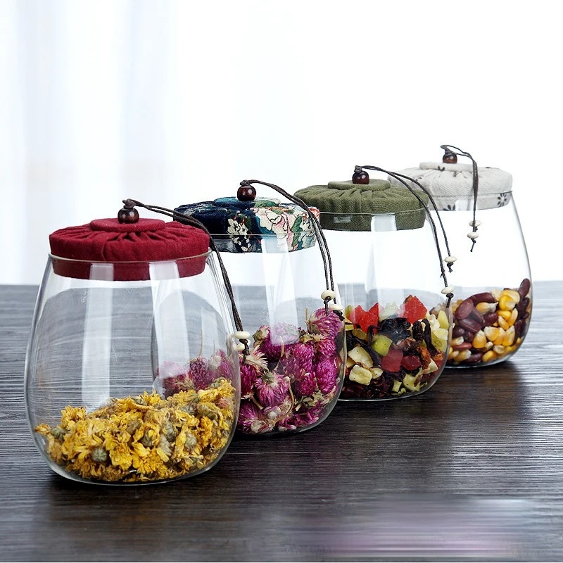 بطرمان 1000ملي بيضاوي بغطاء محكم الغلق مغطي بقماش مزخرف لحمل وتنظيم الكاندي والبلح في المطبخ او علي السفرة