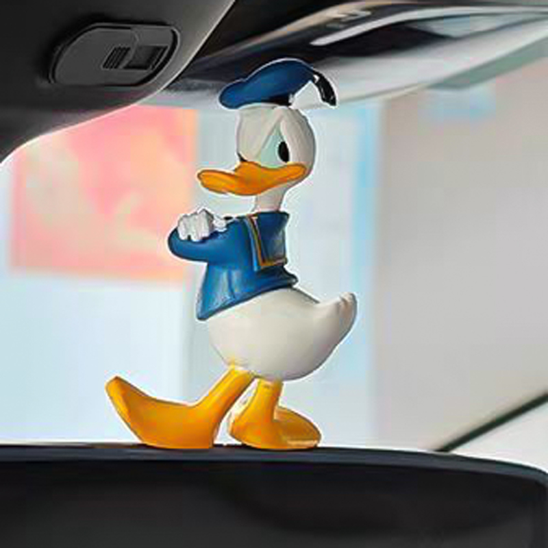 إكسسوار بتصميم بطوط لتزين تابلوه السيارة