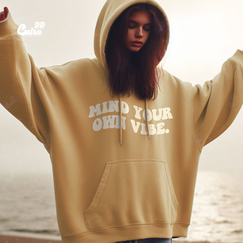 Mind Your Own Vibe هودي اوفر سايز قطن باللون البيج