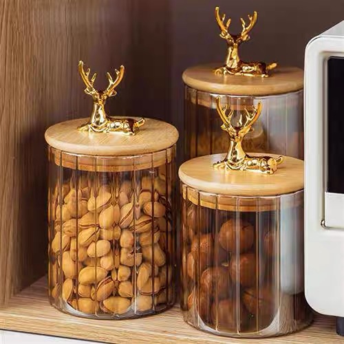 طقم برطمانات زجاج مطلي باللون العسلي 3 قطع باحجام مختلفة بغطاء خشبي بغزالة لحفظ وتنظيم الحبوب والبقوليات والتوابل